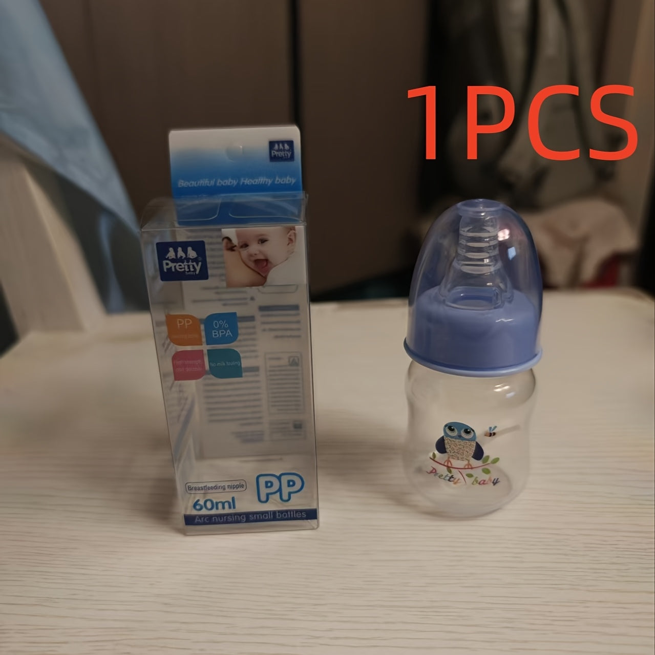 Portable 60ml Baby Bottle with Silicone Nipple for Newborns Up to 6 Months, Ideal for Infant Care.